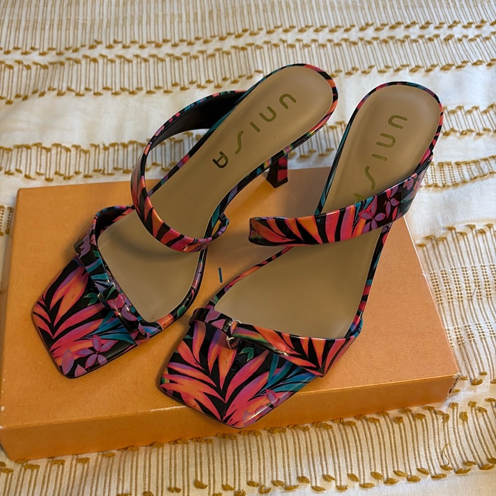 Low heeled sandal in bright floral colors. Only worn a few times